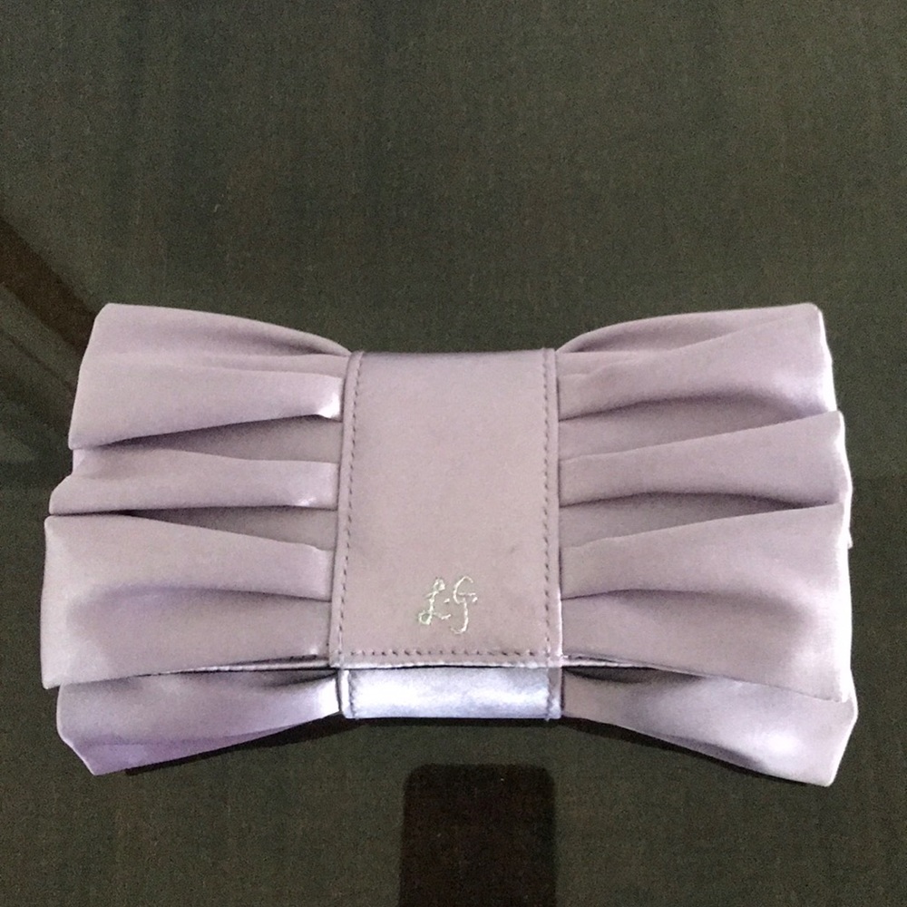 Classy Lulu Guinness London purple clutch